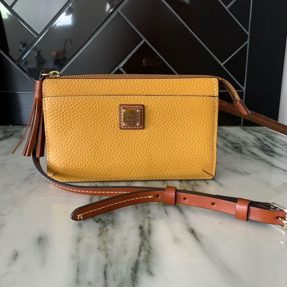 Yellow Dooney & Burke pebble grain leather cross body.